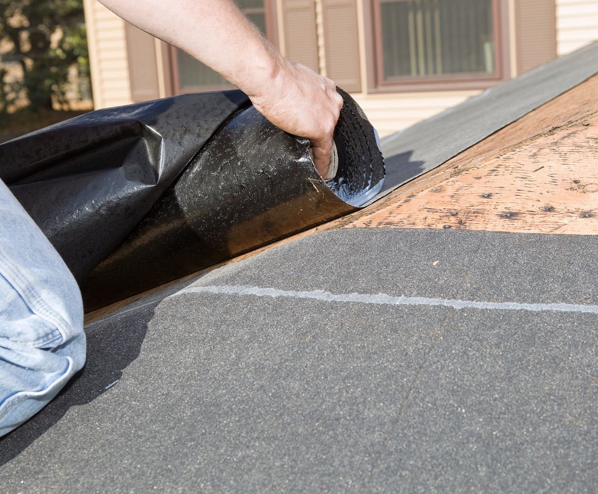 Applying waterproof roof underlayment sheet