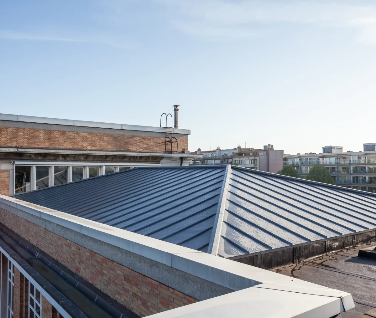 Building rooftop under bright sky